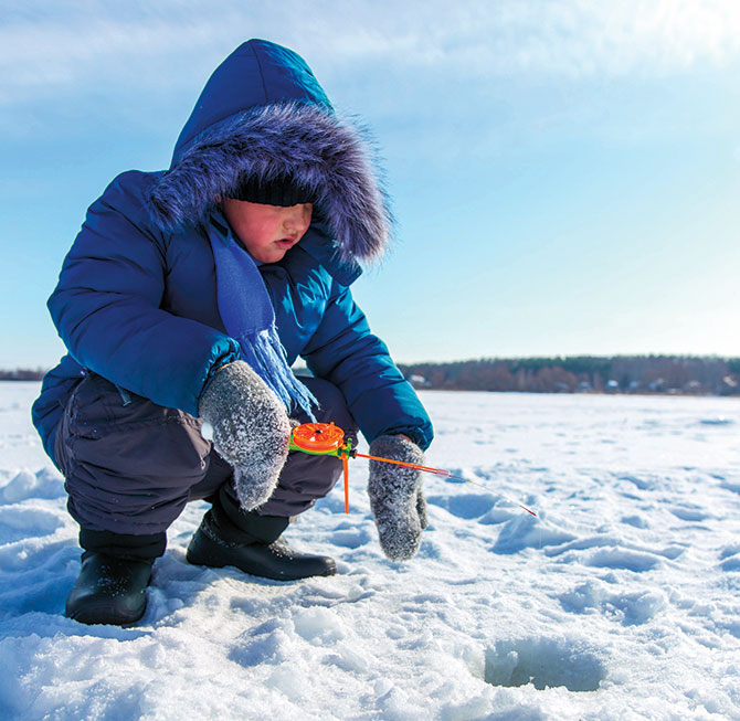 a boy ice fishing