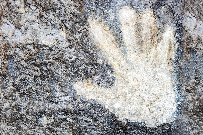 A hand print in stone