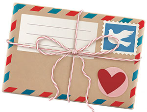 Envelope with a stamp and a heart sticker on it