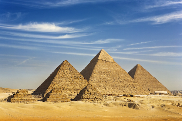 Three large pyramids behind three small ones