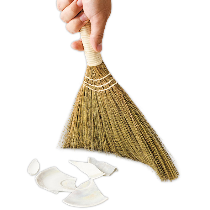 Image of a broom cleaning up broken glass plate