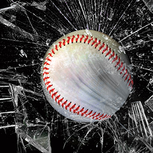 Image of a baseball smashing through glass