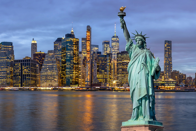 Photo of the Statue of Liberty with the NYC skyline in the background